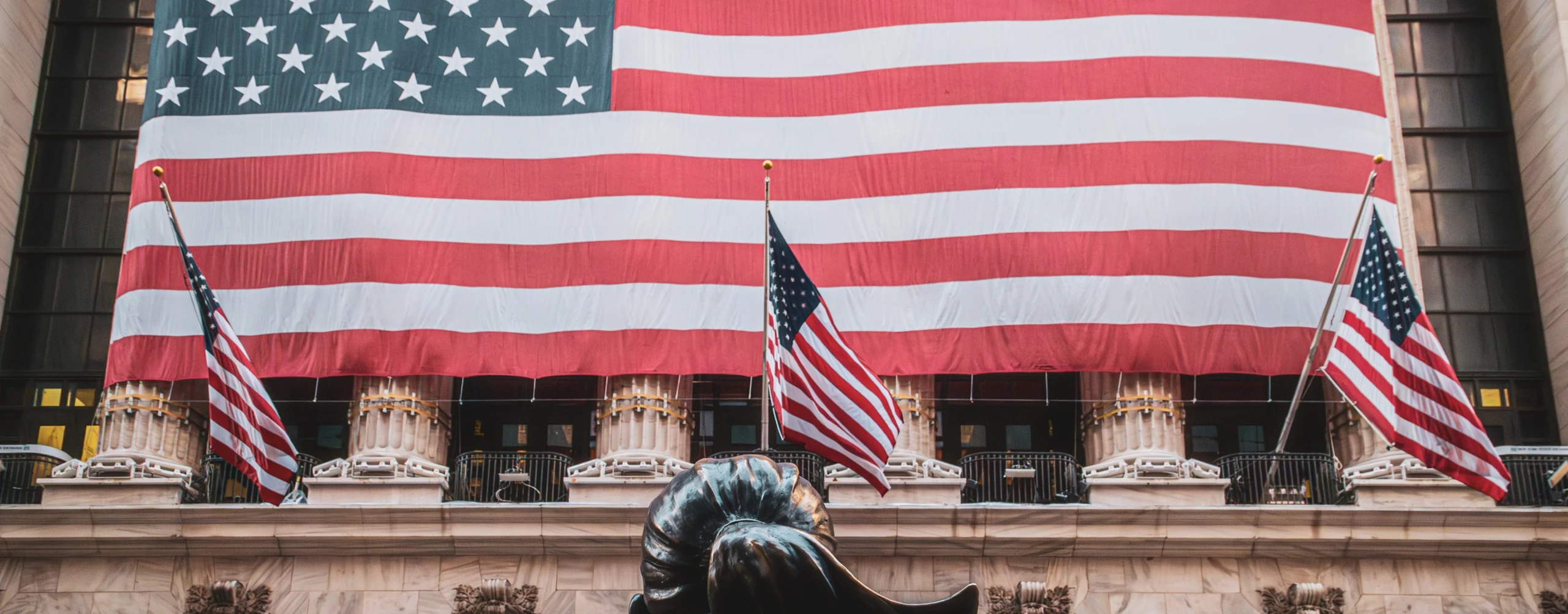The New York Stock Exchange facade draped in American flags